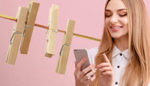 Cellulare e mollette di legno